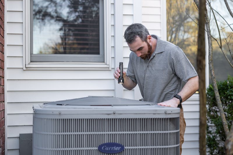 a man checking the HVC system